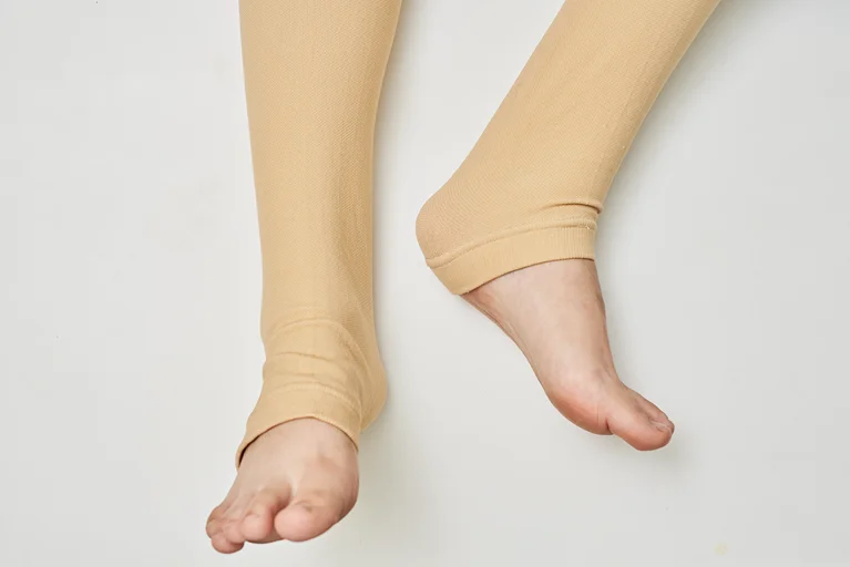 Legs wearing compression stockings