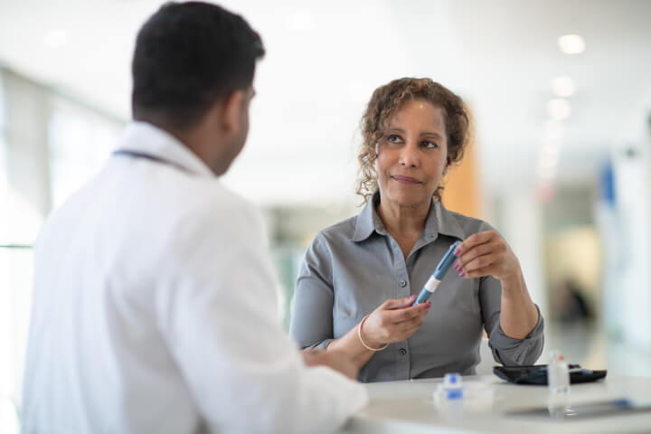 vein doctor consulting with patient over vein treatments